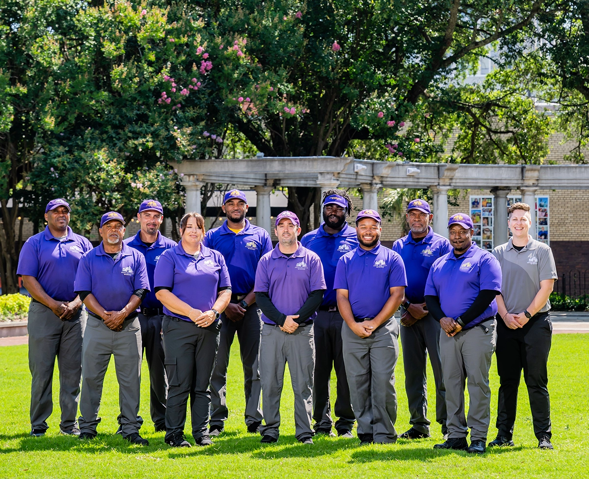 Group photo of downtown mobile alliance bid services employees in cathedral square